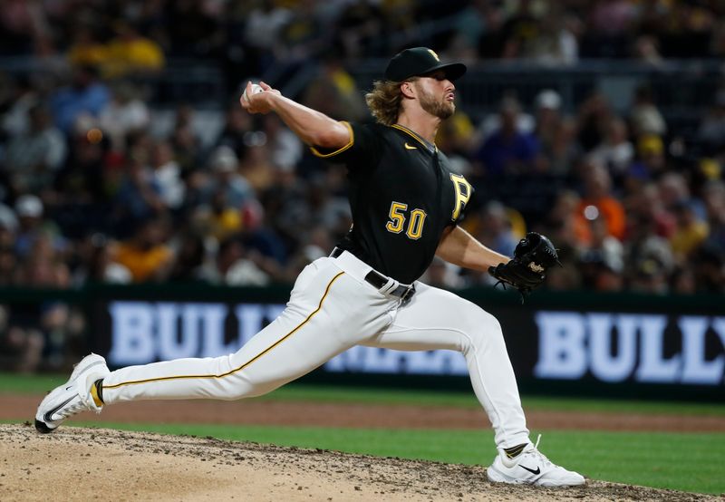 Jul 15, 2023; Pittsburgh, Pennsylvania, USA;  Pittsburgh Pirates relief pitcher Carmen Mlodzinski (50) pitches against the San Francisco Giants during the eighth inning at PNC Park. Mandatory Credit: Charles LeClaire-USA TODAY Sports