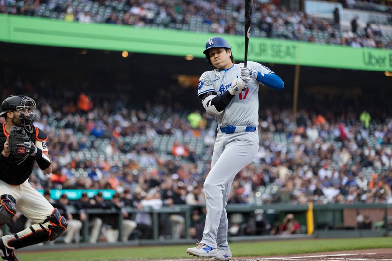 May 15, 2024; San Francisco, California, USA; Los Angeles Dodgers designated hitter Shohei Ohtani (17) reacts after a near pitch by San Francisco Giants starting pitcher Logan Webb (62) during the first inning at Oracle Park. Mandatory Credit: John Hefti-USA TODAY Sports