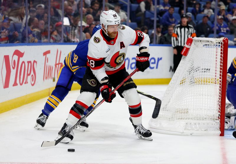 Nov 5, 2024; Buffalo, New York, USA;  Ottawa Senators right wing Claude Giroux (28) looks to make a pass during the third period against the Buffalo Sabres at KeyBank Center. Mandatory Credit: Timothy T. Ludwig-Imagn Images