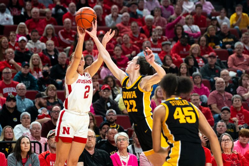 Feb 11, 2024; Lincoln, Nebraska, USA; Nebraska Cornhuskers guard Logan Nissley (2) is blocked by Iowa Hawkeyes guard Caitlin Clark (22) during the second quarter at Pinnacle Bank Arena. Mandatory Credit: Dylan Widger-USA TODAY Sports