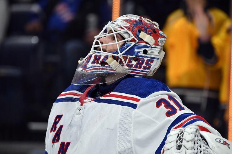 Dec 2, 2023; Nashville, Tennessee, USA; New York Rangers goaltender Igor Shesterkin (31) reacts after allowing a goal during the first period against the Nashville Predators at Bridgestone Arena. Mandatory Credit: Christopher Hanewinckel-USA TODAY Sports