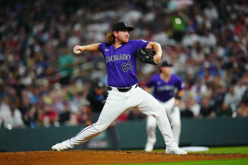 Jul 23, 2024; Denver, Colorado, USA; Colorado Rockies relief pitcher Noah Davis (63) delivers a pitch in the eighth inning against the Boston Red Sox at Coors Field. Mandatory Credit: Ron Chenoy-USA TODAY Sports