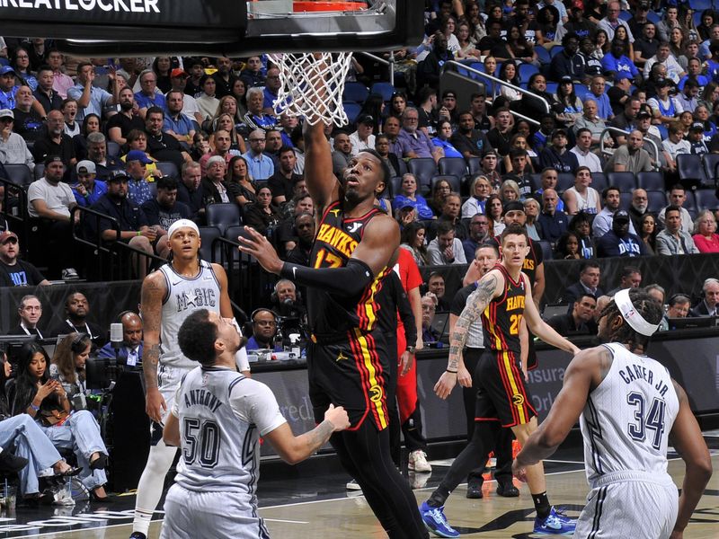 ORLANDO, FL - FEBRUARY 10: Onyeka Okongwu #17 of the Atlanta Hawks drives to the basket during the game against the Orlando Magic on February 10, 2025 at Kia Center in Orlando, Florida. NOTE TO USER: User expressly acknowledges and agrees that, by downloading and or using this photograph, User is consenting to the terms and conditions of the Getty Images License Agreement. Mandatory Copyright Notice: Copyright 2025 NBAE (Photo by Fernando Medina/NBAE via Getty Images)