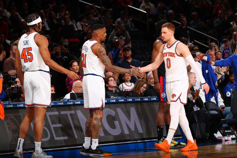 NEW YORK, NY - MARCH 25:  Donte Divincenzo #0 of the New York Knicks is congratulated as he walks to the bench during the game against the Detroit Pistons on March 25, 2024 at Madison Square Garden in New York City, New York.  NOTE TO USER: User expressly acknowledges and agrees that, by downloading and or using this photograph, User is consenting to the terms and conditions of the Getty Images License Agreement. Mandatory Copyright Notice: Copyright 2024 NBAE  (Photo by David L. Nemec /NBAE via Getty Images)