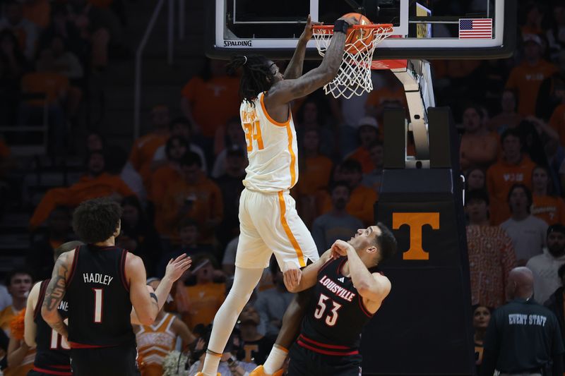 Dec 16, 2025; Knoxville, Tennessee, USA;  Tennessee Volunteers center Felix Okpara (34) dunks the ball against the Louisville Cardinals during the second half at Thompson-Boling Arena at Food City Center. Mandatory Credit: Randy Sartin-Imagn Images