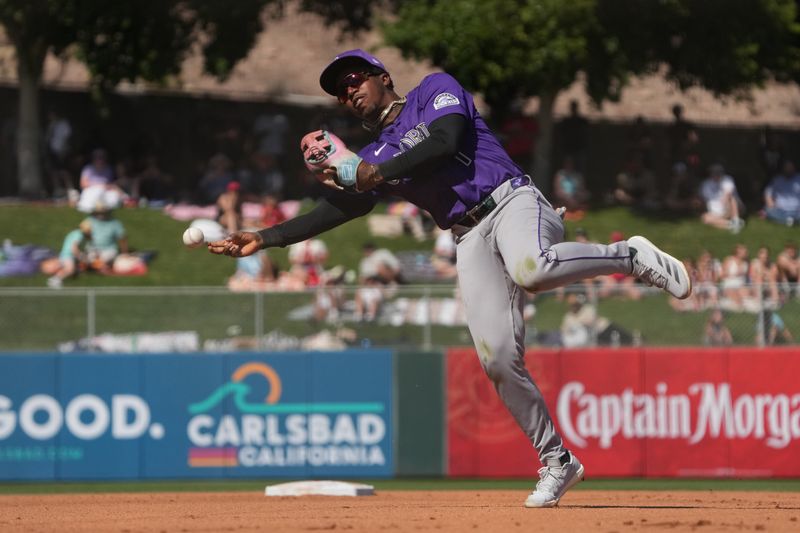 Mar 10, 2025; Tempe, Arizona, USA; Colorado Rockies second base Adael Amador (1) makes the play for an out against the Los Angeles Angels in the fourth inning at Tempe Diablo Stadium. Mandatory Credit: Rick Scuteri-Imagn Images