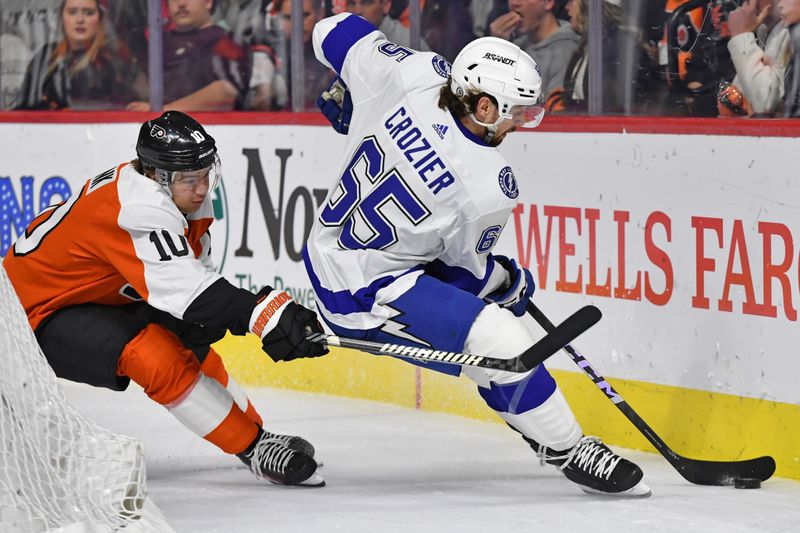 Feb 27, 2024; Philadelphia, Pennsylvania, USA; Tampa Bay Lightning defenseman Maxwell Crozier (65) and Philadelphia Flyers right wing Bobby Brink (10) battle for the puck during the first period at Wells Fargo Center. Mandatory Credit: Eric Hartline-USA TODAY Sports