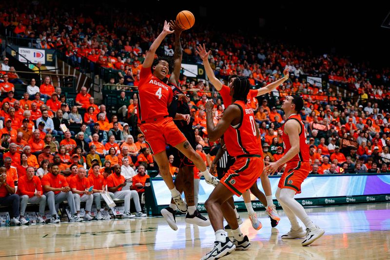 Feb 21, 2026; Fort Collins, Colorado, USA; Colorado State Rams guard Jase Butler (4) battles for a rebound with San Diego State Aztecs guard Reese Dixon-Waters (39) as forward Kyle Jorgensen (35) and forward Carey Booth (0) and forward Jevin Muniz (55) defend in the first half at Moby Arena. Mandatory Credit: Isaiah J. Downing-Imagn Images