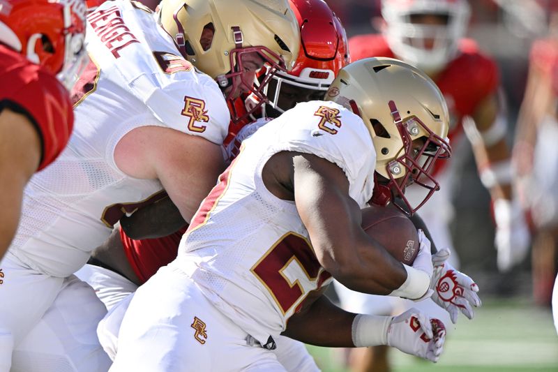 Sep 23, 2023; Louisville, Kentucky, USA;  Boston College Eagles running back Alex Broome (20) runs the ball against the Louisville Cardinals  during the first half at L&N Federal Credit Union Stadium. Mandatory Credit: Jamie Rhodes-USA TODAY Sports