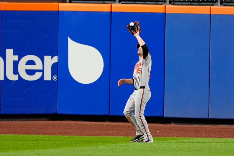 Aug 19, 2024; New York City, New York, USA; Baltimore Orioles left fielder Austin Slater (15) catches a fly ball hit by New York Mets shortstop Francisco Lindor (not pictured) during the third inning at Citi Field. Mandatory Credit: Gregory Fisher-USA TODAY Sports