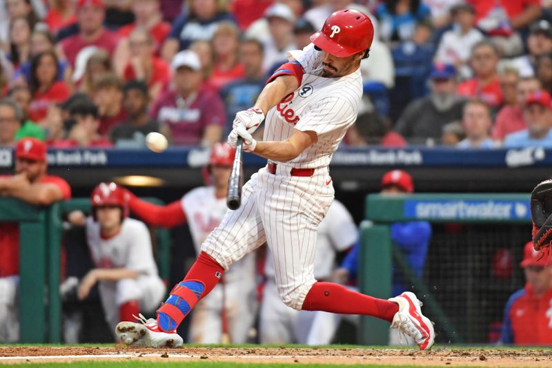 Jun 2, 2024; Philadelphia, Pennsylvania, USA; Philadelphia Phillies catcher Garrett Stubbs (21) hits an RBI single against the St. Louis Cardinals during the second inning at Citizens Bank Park. Mandatory Credit: Eric Hartline-USA TODAY Sports