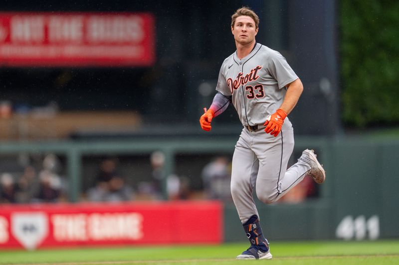 Jul 4, 2024; Minneapolis, Minnesota, USA; Detroit Tigers second baseman Colt Keith (33) loses his helmet as he rounds the bases after hitting a first inning home run on Minnesota Twins pitcher Bailey Ober (17) at Target Field. Mandatory Credit: Matt Blewett-USA TODAY Sports