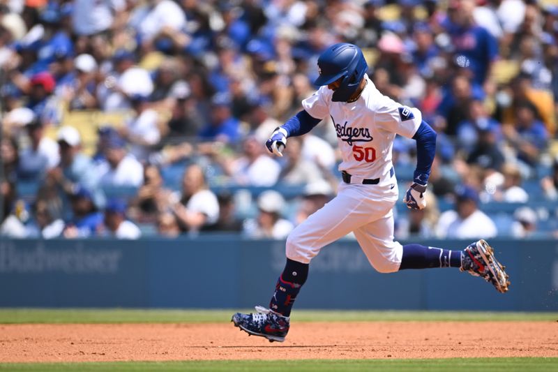 Apr 20, 2024; Los Angeles, California, USA; Los Angeles Dodgers shortstop Mookie Betts (50) doubles against the New York Mets during the first inning at Dodger Stadium. Mandatory Credit: Jonathan Hui-USA TODAY Sports