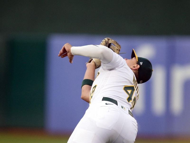 Jun 16, 2023; Oakland, California, USA; Oakland Athletics first baseman Ryan Noda (49) makes the catch during the fifth inning at Oakland-Alameda County Coliseum. Mandatory Credit: D. Ross Cameron-USA TODAY Sports