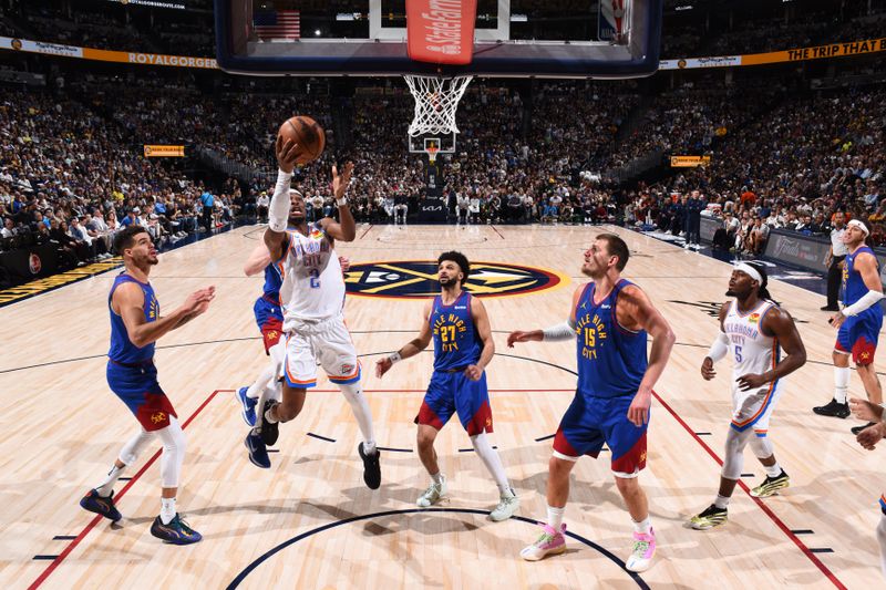DENVER, CO - MAY 9:   Shai Gilgeous-Alexander #2 of the Oklahoma City Thunder drives to the basket during the game against the Denver Nuggets during Round Two Game Three of the 2025 NBA Playoffs on May 9, 2025 at Ball Arena in Denver, Colorado. NOTE TO USER: User expressly acknowledges and agrees that, by downloading and/or using this Photograph, user is consenting to the terms and conditions of the Getty Images License Agreement. Mandatory Copyright Notice: Copyright 2025 NBAE (Photo by Garrett Ellwood/NBAE via Getty Images)