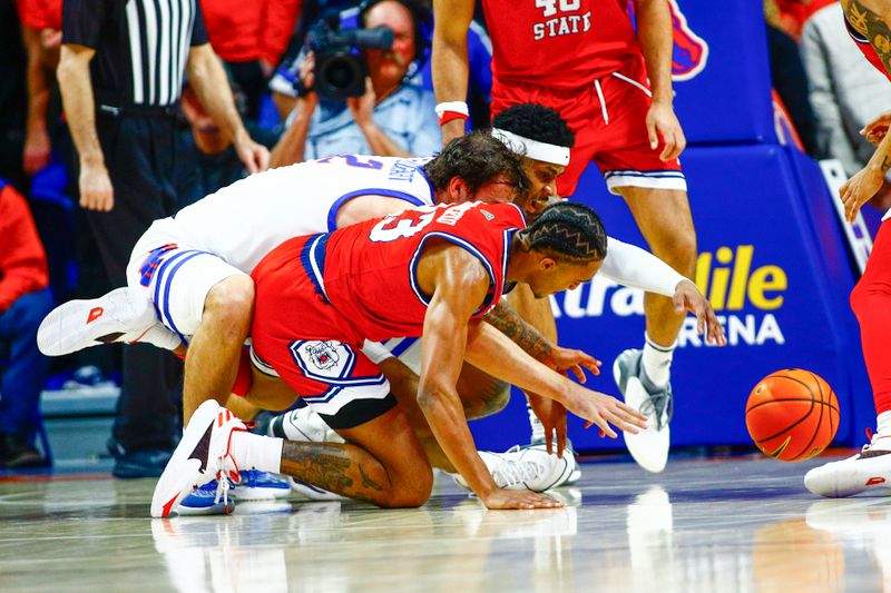 Feb 17, 2024; Boise, Idaho, USA; Fresno State Bulldogs guard Xavier DuSell (53) and Boise State Broncos forward Tyson Degenhart (2) along with forward guard Chibuzo Agbo (11)ramble for the ball during the first half aat ExtraMile Arena. Mandatory Credit: Brian Losness-USA TODAY Sports
