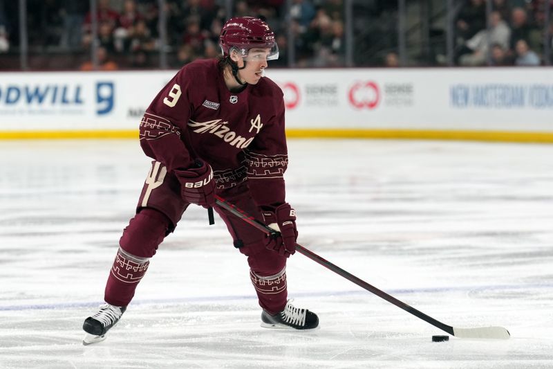 Mar 3, 2023; Tempe, Arizona, USA; Arizona Coyotes right wing Clayton Keller (9) skates the puck against the Carolina Hurricanes during the second period at Mullett Arena. Mandatory Credit: Joe Camporeale-USA TODAY Sports