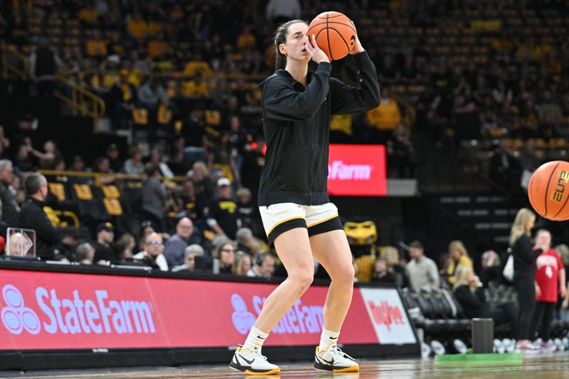 Mar 3, 2024; Iowa City, Iowa, USA; Iowa Hawkeyes guard Caitlin Clark (22) warms up before the game against the Ohio State Buckeyes at Carver-Hawkeye Arena. Clark is attempting to break the NCAA basketball all-time scoring record. Mandatory Credit: Jeffrey Becker-USA TODAY Sports