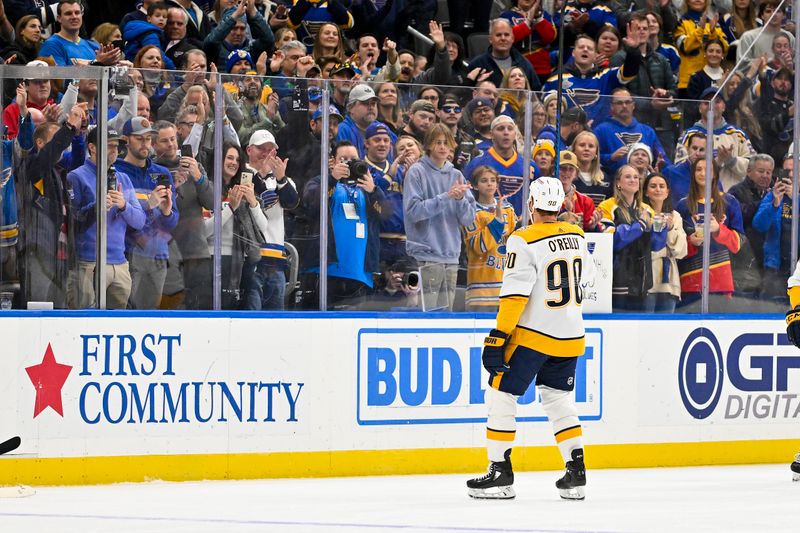 Nov 24, 2023; St. Louis, Missouri, USA;  Nashville Predators center Ryan O'Reilly (90) salutes the crowd as he is honored during his first game back during the first period against the St. Louis Blues at Enterprise Center. Mandatory Credit: Jeff Curry-USA TODAY Sports