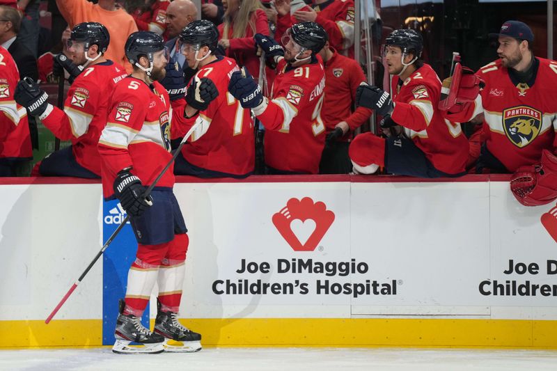 Feb 20, 2024; Sunrise, Florida, USA; Florida Panthers defenseman Aaron Ekblad (5) celebrates a goal against the Ottawa Senators during the first period at Amerant Bank Arena. Mandatory Credit: Jim Rassol-USA TODAY Sports