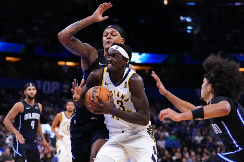 ORLANDO, FLORIDA - OCTOBER 28: Pascal Siakam #43 of the Indiana Pacers drives to the basket against Paolo Banchero #5 of the Orlando Magic during the fourth quarter at Kia Center on October 28, 2024 in Orlando, Florida. NOTE TO USER: User expressly acknowledges and agrees that, by downloading and or using this photograph, User is consenting to the terms and conditions of the Getty Images License Agreement. (Photo by Rich Storry/Getty Images)