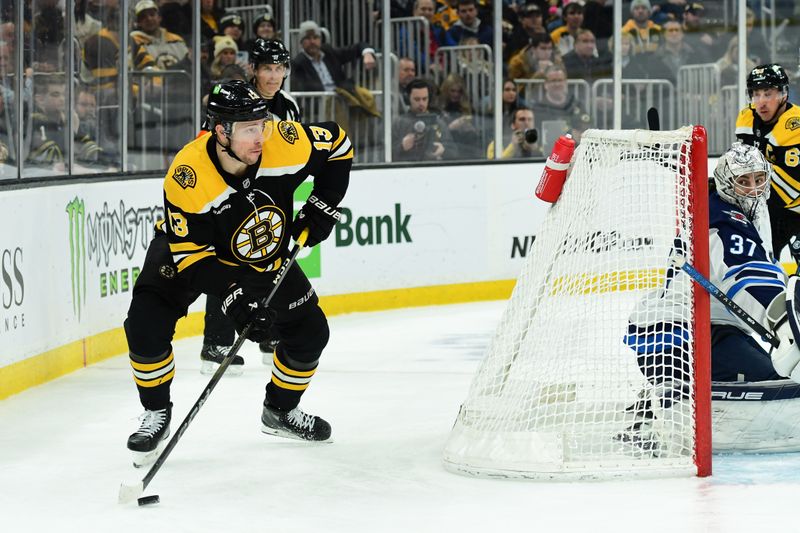 Jan 30, 2025; Boston, Massachusetts, USA; Boston Bruins center Charlie Coyle (13) looks to make a pass during the third period against the Winnipeg Jets at TD Garden. Mandatory Credit: Bob DeChiara-Imagn Images