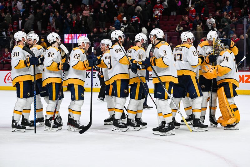 Dec 10, 2023; Montreal, Quebec, CAN; Nashville Predators players gather to celebrate the win against the Montreal Canadiens after the third period at Bell Centre. Mandatory Credit: David Kirouac-USA TODAY Sports