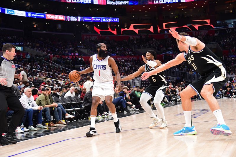 LOS ANGELES, CA - MARCH 10: James Harden #1 of the LA Clippers dribbles the ball during the gameagainst the Milwaukee Bucks on March 10, 2024 at Crypto.Com Arena in Los Angeles, California. NOTE TO USER: User expressly acknowledges and agrees that, by downloading and/or using this Photograph, user is consenting to the terms and conditions of the Getty Images License Agreement. Mandatory Copyright Notice: Copyright 2024 NBAE (Photo by Adam Pantozzi/NBAE via Getty Images)