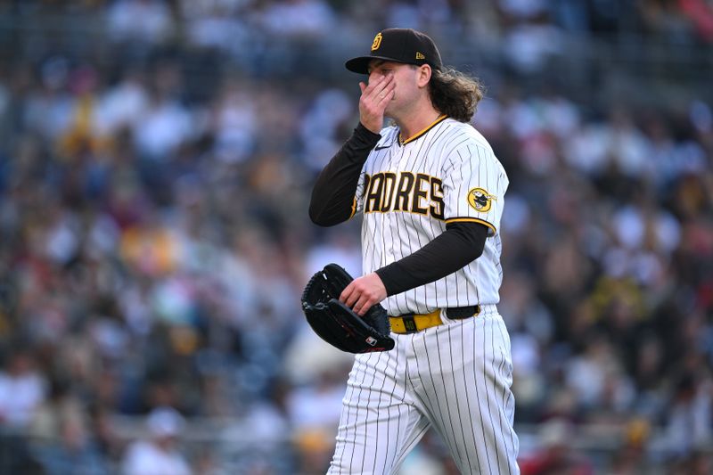 Jun 15, 2023; San Diego, California, USA; San Diego Padres starting pitcher Ryan Weathers (40) wipes his face while walking to the dugout after being replaced in the second inning against the Cleveland Guardians at Petco Park. Mandatory Credit: Orlando Ramirez-USA TODAY Sports