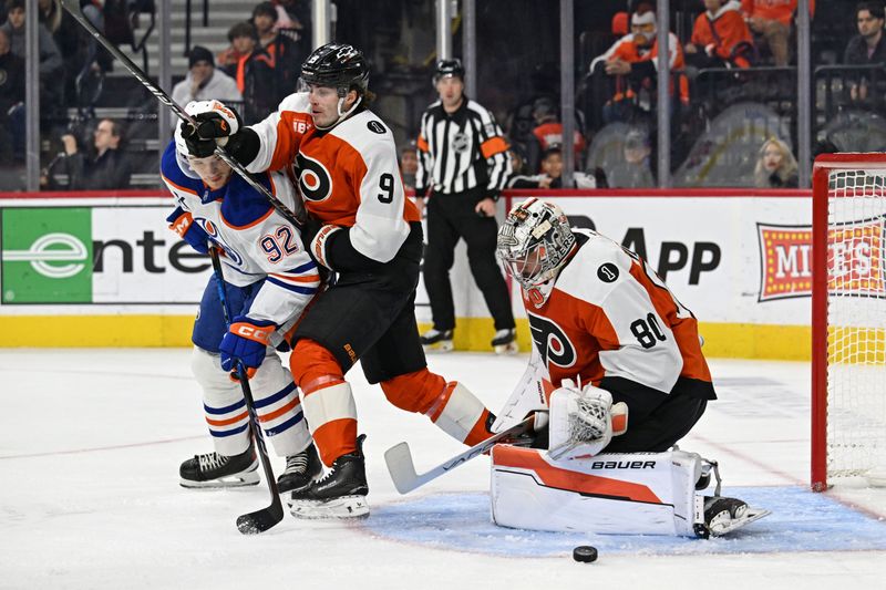 Nov 12, 2025; Philadelphia, Pennsylvania, USA; Edmonton Oilers right wing Vasily Podkolzin (92) battles with Philadelphia Flyers defenseman Jamie Drysdale (9) asgoaltender Dan Vladar (80) makes a save during the second period at Xfinity Mobile Arena. Mandatory Credit: Eric Hartline-Imagn Images