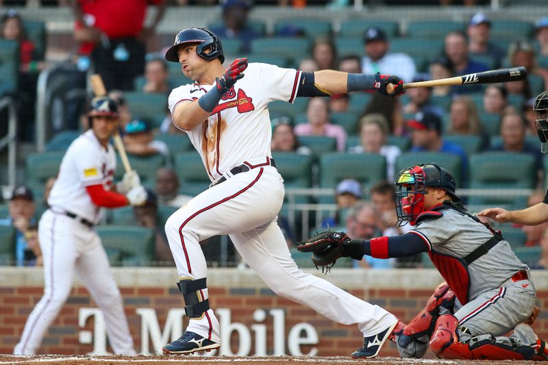 Jun 27, 2023; Atlanta, Georgia, USA; Atlanta Braves third baseman Austin Riley (27) hits a single against the Minnesota Twins in the second inning at Truist Park. Mandatory Credit: Brett Davis-USA TODAY Sports