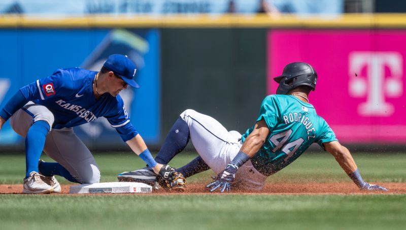 May 15, 2024; Seattle, Washington, USA; Kansas City Royals second baseman Michael Massey (19) tags out Seattle Mariners centerfielder Julio Rodriguez (44) attempting to steal second base during the first inning at T-Mobile Park. Mandatory Credit: Stephen Brashear-USA TODAY Sports