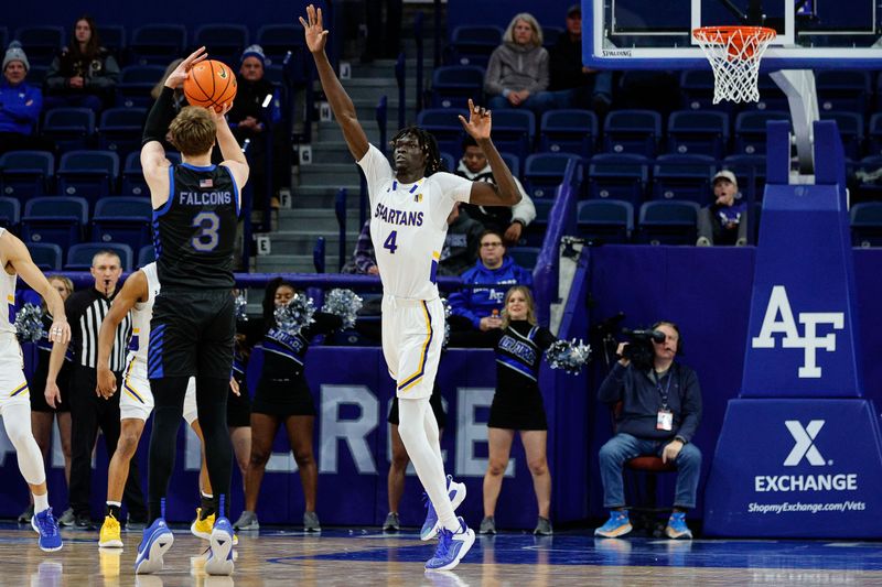 Jan 13, 2024; Colorado Springs, Colorado, USA; Air Force Falcons forward Luke Kearney (3) attempts a shot as San Jose State Spartans center Adrame Diongue (4) guards in the second half at Clune Arena. Mandatory Credit: Isaiah J. Downing-USA TODAY Sports