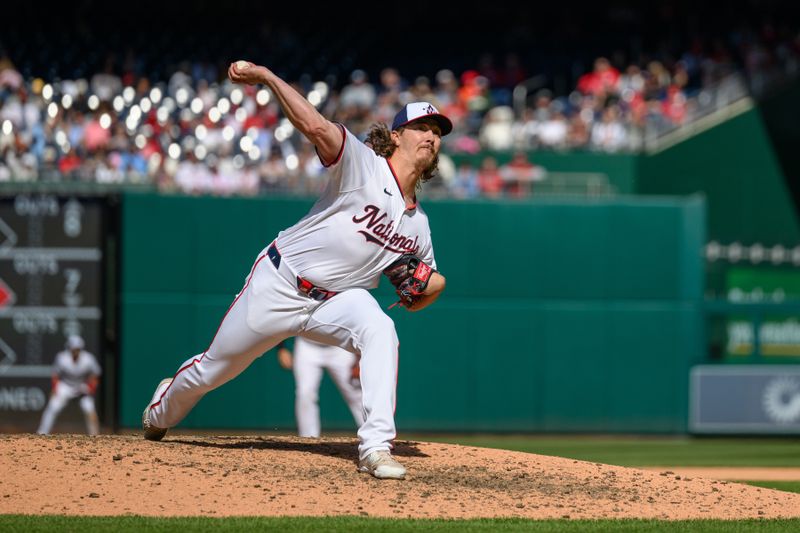 Apr 7, 2024; Washington, District of Columbia, USA; Washington Nationals pitcher Hunter Harvey (73) throws a pitch during the eighth inning against the Philadelphia Phillies at Nationals Park. Mandatory Credit: Reggie Hildred-USA TODAY Sports