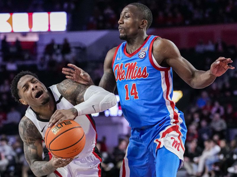 Feb 7, 2023; Athens, Georgia, USA; Georgia Bulldogs guard Justin Hill (11) tries to bring the ball past Mississippi Rebels guard Tye Fagan (14) during the second half at Stegeman Coliseum. Mandatory Credit: Dale Zanine-USA TODAY Sports