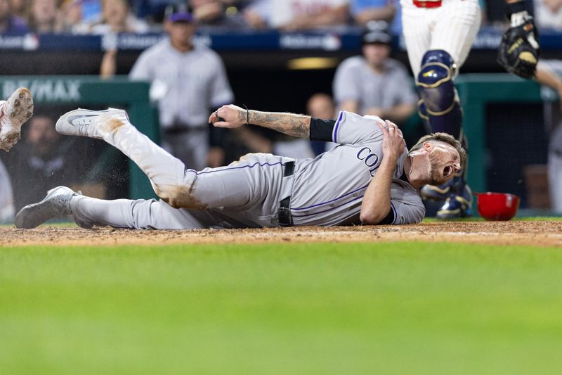 Apr 15, 2024; Philadelphia, Pennsylvania, USA; Colorado Rockies pinch runner Kyle Freeland (42) reacts after being tagged out at home plate during the ninth inning against the Philadelphia Phillies at Citizens Bank Park. Mandatory Credit: Bill Streicher-USA TODAY Sports