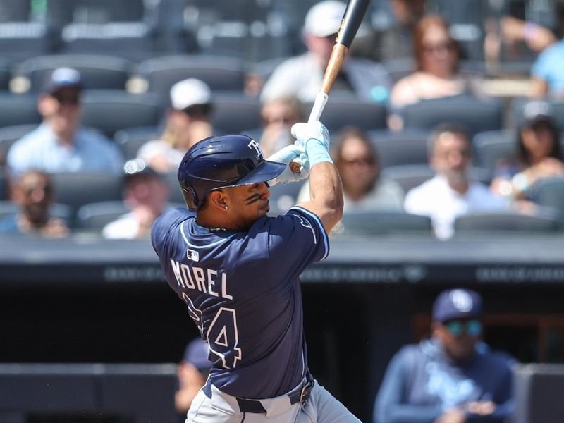 May 3, 2025; Bronx, New York, USA;  Tampa Bay Rays left fielder Christopher Morel (24) hits a single in the fifth inning against the New York Yankees at Yankee Stadium. Mandatory Credit: Wendell Cruz-Imagn Images