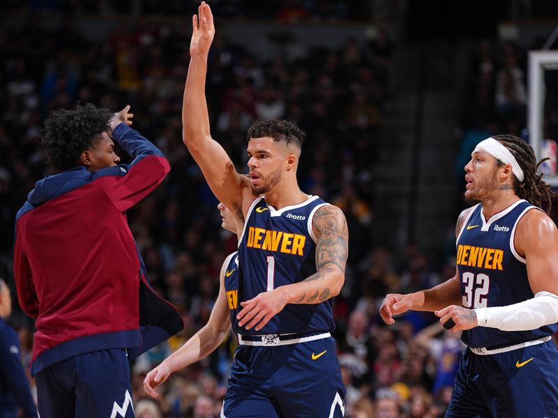 DENVER, CO - DECEMBER 13: Michael Porter Jr. #1 and Peyton Watson #8 of the Denver Nuggets high five during the game against the LA Clippers on December 13, 2024 at Ball Arena in Denver, Colorado. NOTE TO USER: User expressly acknowledges and agrees that, by downloading and/or using this Photograph, user is consenting to the terms and conditions of the Getty Images License Agreement. Mandatory Copyright Notice: Copyright 2024 NBAE (Photo by Garrett Ellwood/NBAE via Getty Images)