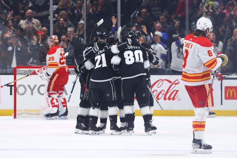 Dec 23, 2023; Los Angeles, California, USA; Los Angeles Kings players celebrate a goal by Los Angeles Kings center Pierre-Luc Dubois (80) during the first period against the Calgary Flames at Crypto.com Arena. Mandatory Credit: Jessica Alcheh-USA TODAY Sports