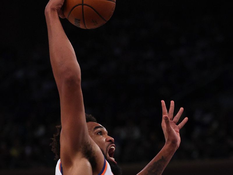 NEW YORK, NEW YORK - NOVEMBER 13: Karl-Anthony Towns #32 of the New York Knicks dunks the ball against the Chicago Bulls during the second quarter at Madison Square Garden on November 13, 2024 in New York City. NOTE TO USER: User expressly acknowledges and agrees that, by downloading and or using this photograph, User is consenting to the terms and conditions of the Getty Images License Agreement. (Photo by Elsa/Getty Images)