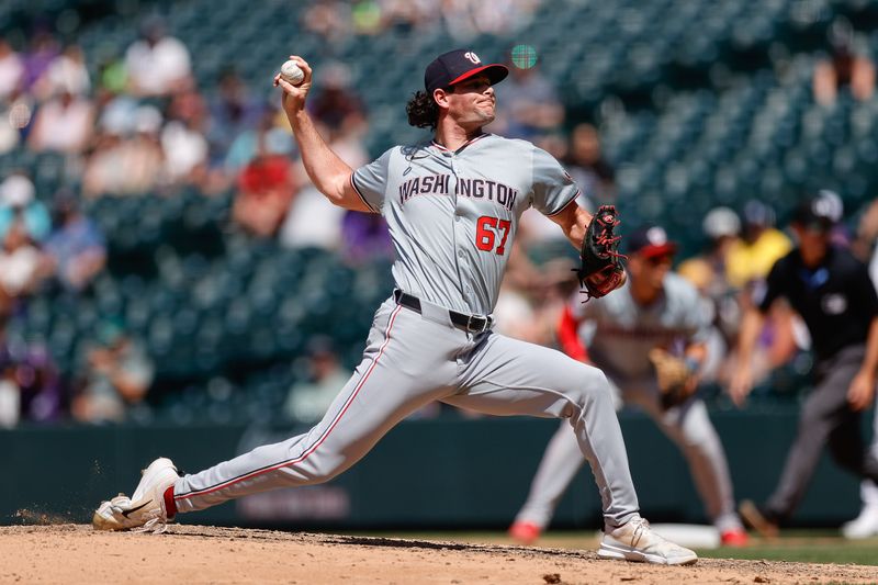 Jun 23, 2024; Denver, Colorado, USA; Washington Nationals relief pitcher Kyle Finnegan (67) pitches in the ninth inning against the Colorado Rockies at Coors Field. Mandatory Credit: Isaiah J. Downing-USA TODAY Sports