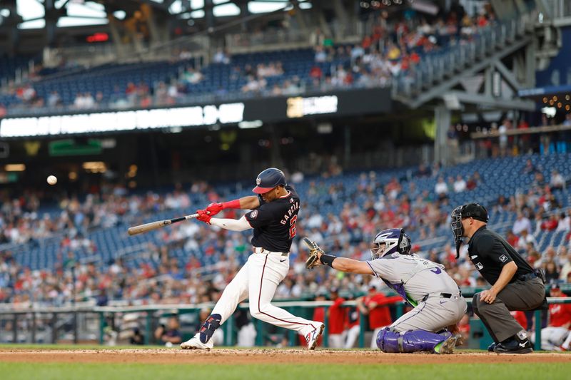 Aug 21, 2024; Washington, District of Columbia, USA; Washington Nationals second baseman Luis García Jr. (2) hits a three run home run against the Colorado Rockies during the third inning at Nationals Park. Mandatory Credit: Geoff Burke-USA TODAY Sports