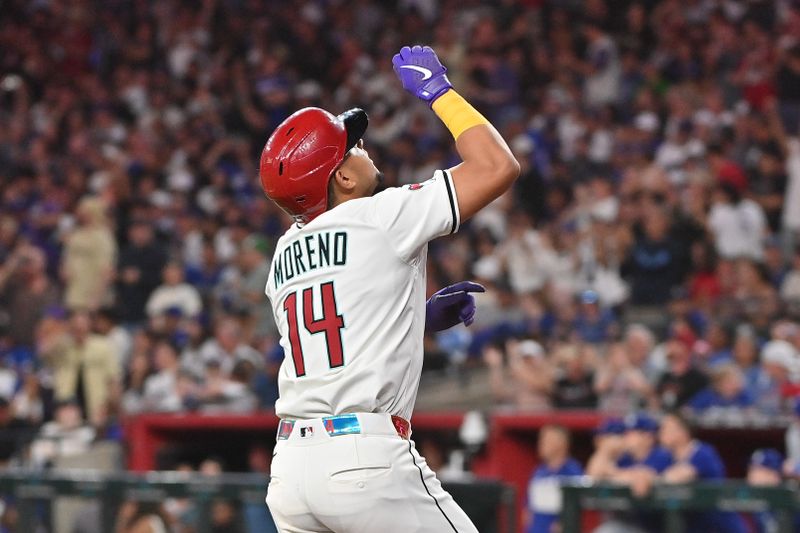 May 8, 2025; Phoenix, Arizona, USA; Arizona Diamondbacks catcher Gabriel Moreno (14) celebrates after hitting a grand slam home run in the fourth inning against the Los Angeles Dodgers at Chase Field. Mandatory Credit: Matt Kartozian-Imagn Images