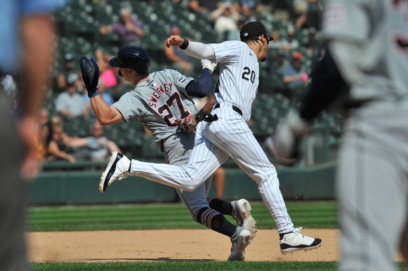 Aug 25, 2024; Chicago, Illinois, USA; Chicago White Sox third base Miguel Vargas (20) tags out Detroit Tigers shortstop Trey Sweeney (27) to complete a double play in the run down during the fifth inning at Guaranteed Rate Field. Mandatory Credit: Patrick Gorski-USA TODAY Sports