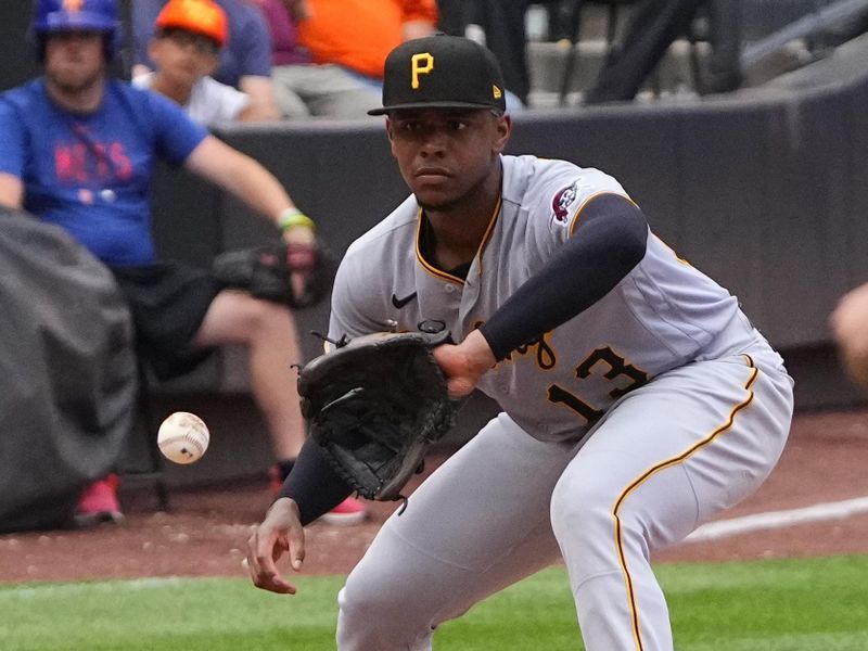 Aug 16, 2023; New York City, New York, USA; Pittsburgh Pirates third baseman Ke'Bryan Hayes (13) fields a ground ball hit by New York Mets shortstop Francisco Lindor (not pictured) during the sixth inning at Citi Field. Mandatory Credit: Gregory Fisher-USA TODAY Sports