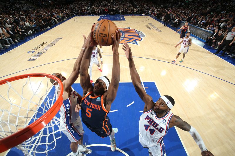 NEW YORK, NY - MARCH 12:  Precious Achiuwa #5 of the New York Knicks drives to the basket during the game against the Philadelphia 76ers on March 12, 2024 at Madison Square Garden in New York City, New York.  NOTE TO USER: User expressly acknowledges and agrees that, by downloading and or using this photograph, User is consenting to the terms and conditions of the Getty Images License Agreement. Mandatory Copyright Notice: Copyright 2024 NBAE  (Photo by Nathaniel S. Butler/NBAE via Getty Images)