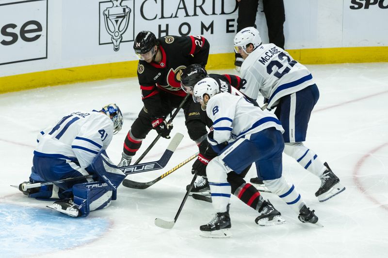 Apr 26, 2025; Ottawa, Ontario, CAN; Toronto Maple Leafs goalie Anthony Stolarz (41) makes a save in front of Ottawa Senators center Dylan Cozens (24) in overtime in game four of the first round of the 2025 Stanley Cup Playoffs at Canadian Tire Centre. Mandatory Credit: Marc DesRosiers-Imagn Images