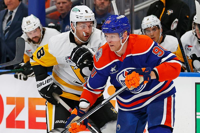 Oct 25, 2024; Edmonton, Alberta, CAN; Edmonton Oilers forward Corey Perry (90) and Pittsburgh Penguins forward Michael Bunting (8) battles for position during the second period at Rogers Place. Mandatory Credit: Perry Nelson-Imagn Images