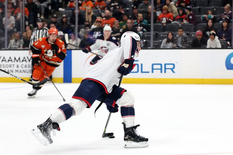 Dec 20, 2025; Anaheim, California, USA;  Columbus Blue Jackets defenseman Denton Mateychuk (5) shoots the puck during the third period against the Anaheim Ducks at Honda Center. Mandatory Credit: Kiyoshi Mio-Imagn Images