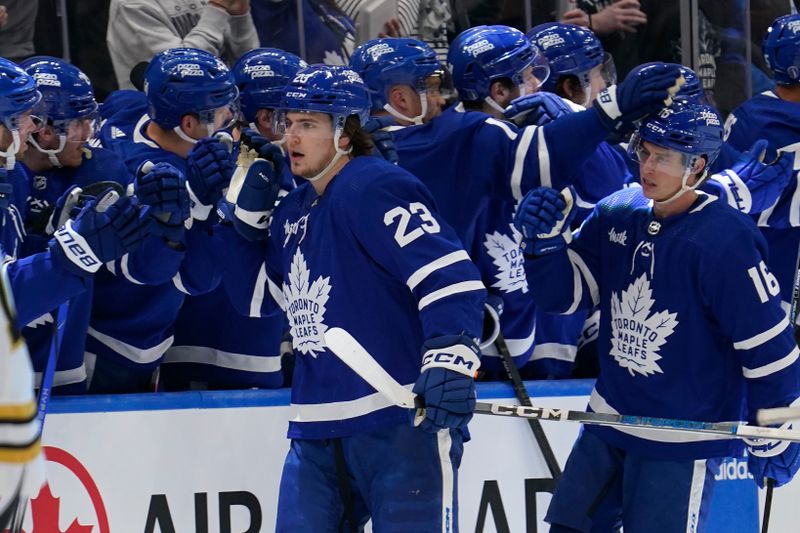 Apr 24, 2024; Toronto, Ontario, CAN; Toronto Maple Leafs forward Matthew Knies (23) gets congratulated after a goal against the Boston Bruins during the second period of game three of the first round of the 2024 Stanley Cup Playoffs at Scotiabank Arena. Mandatory Credit: John E. Sokolowski-USA TODAY Sports